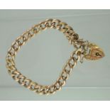 9ct rose gold hollow curb link bracelet with engraved links. Having heart shaped padlock clasp and