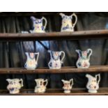 A collection of assorted Gaudy Welsh dresser jugs including; Snowdonia, Imari and other designs;