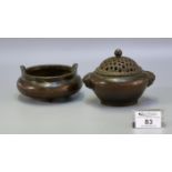Small Chinese patinated bronze censer having open work pierced cover, and lion mask mounts to the