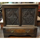 18th century Welsh oak coffer bach, the moulded top above two fielded panels ornately carved with