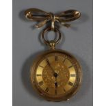 18ct gold fancy key wind fob watch with engine turned Roman face and foliate engraved case, inner