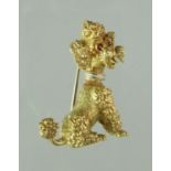 18ct gold brooch modelled as a poodle with ruby eyes. Approx 29x21mm. Approx weight 7.8 grams. (B.P.
