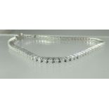 A Diamond line bracelet set in 18ct white gold. Estimated total diamond weight 2.9cts. Length 7.5