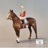 Beswick racehorse and jockey no. 12 with yellow cap and green and red colours. (B.P. 21% + VAT) No