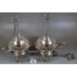 Unusual novelty silver plated, two-section bottle coasters with glass decanters and stoppers in