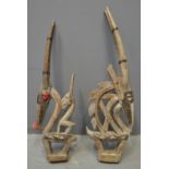 Pair of Chiawara West African carved hardwood antelope design headdresses with nailed metal