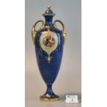 Royal Worcester porcelain two handled lidded vase on a blue ground with hand painted fruit panels,