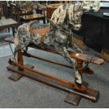 Early 20th Century dapple grey child's rocking horse on patent swing stand, with leather saddle