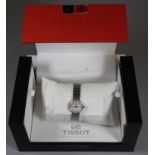 Tissot stainless steel lady's bracelet wristwatch with baton numerals on integral bracelet strap and