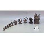 Interesting collection of Burmese patinated bronze graduated 'Hintha Bird' opium weights, a set of