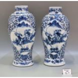 Pair of Chinese porcelain Late Qing 'mirror matched' blue and white baluster shaped vases painted