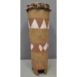 South African carved and polychrome decorated free standing cylindrical tribal drum with skin