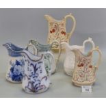 A collection of Ynysmeudwy Welsh pottery dresser jugs in various designs to include; 'Strawberry'