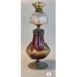 19th Century brass double burner oil lamp with cut glass reservoir on a ceramic vase shaped base