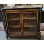 Victorian walnut and ebonised two door pier cabinet, the moulded and shaped top flanked by two