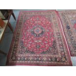 Middle Eastern design Mashad carpet mainly on a red and blue ground decorated with large central