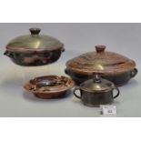 Group of Nigerian Abuja stoneware pottery items to include; two circular tureens and covers, both