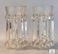 A pair of Victorian clear glass vase lustres having glass spandrels and faceted decoration, standing