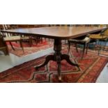 19th Century mahogany breakfast table standing on a baluster moulded pedestal quatreform base with