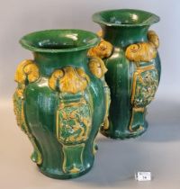 Pair of Chinese stoneware baluster shaped vases decorated with relief panels of four clawed