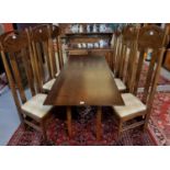 In the style of Charles Rennie Mackintosh a set of six high back oak dining chairs with table of