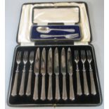 Cased set of 12 silver handled and steel bladed knives and forks, together with a cased silver