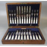 Oak cased set of silver plate and mother of pearl fish knives and forks with silver collars, the box