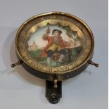 Novelty brass and cast metal roulette game in the form of a ships wheel with printed figure. (B.P.