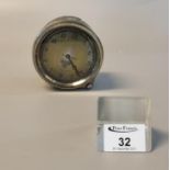 Smith's car dashboard clock with Arabic numerals and brass originally plated bezel. The face