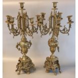Pair of brass four-branch table candelabrum in classical style. 62cm high approx. (2) (B.P. 21 +