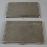 Two silver engine turned cigarette cases of plain form, 12.8 troy ozs approx. (B.P. 21% + VAT)