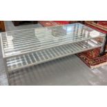 Modern low metal framed glass topped rectangular coffee table. 125cm wide approx. (B.P. 21% + VAT)