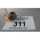 Yellow metal dress ring set with a cabochon agate. Ring size M. Approx weight 4.1 grams. (B.P. 21% +