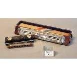 A Hohner large Echo 4 in 1 harmonica, together with a Hohner Echo Vamper harmonica in Hohner '