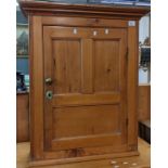 19th Century stripped pine hanging cupboard with panelled door revealing two fitted shelves to the