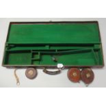 Vintage tan leather gun case, the interior revealing three vintage leather and brass measuring