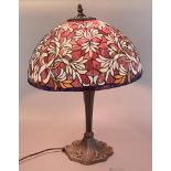 Large modern Tiffany style table lamp, the bronzed base with foliate leaded type shade. 57cm high