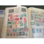 All world stamp collection in green Meteor album, many 100s of stamps, mint and used. (B.P. 21% +