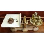 Set of grocer's scales with ceramic platform and an assortment of weights including a graduated