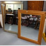 Two modern mirrors; one with silver frame, the other pine framed. (2) (B.P. 21% + VAT)