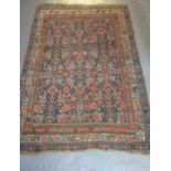 Middle Eastern design blue ground rug having multi-coloured flowers and foliage. 115 x 160cm approx.