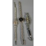 Two silver and marcasite lady's cocktail watches, together with another lady's watch marked