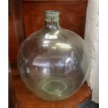 Traditional green tinted glass carboy. 58cm high approx. (B.P. 21 + VAT)