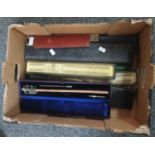 Box of assorted drawing equipment items to include; rulers, calculating slide rulers, drawing sets