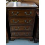 Reproduction mahogany Georgian style chest of four cock beaded drawers under a cross banded top.