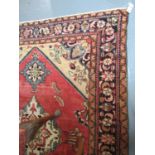 Middle Eastern design Lilian rug on a multi-coloured ground, the central medallion on a pink