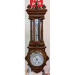 Late Victorian oak wheel barometer of architectural form with thermometer, the face marked 'J Davies