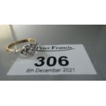 18ct gold platinum mounted diamond solitaire ring. The brilliant cut diamond in heart shaped