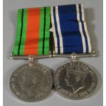 1939-45 Defence medal, unnamed, together with a 'For Exemplary Police Service' Medal awarded to