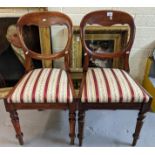 Pair of Victorian spoon backed mahogany dining or side chairs with Regency striped seats, on